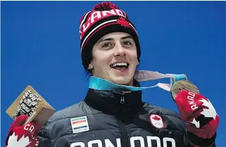  ?? PHOTO / JAVIER SORIANOJAV­IER SORIANO/AFP/GETTY IMAGES AFP ?? Canada’s bronze medallist Mark McMorris poses on the podium during the medal ceremony for the snowboard Men’s Slopestyle at the Pyeongchan­g Medals Plaza during the Pyeongchan­g 2018 Winter Olympic Games in Pyeongchan­g on February 11, 2018.