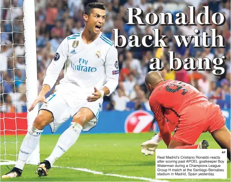  ?? AP ?? Real Madrid’s Cristiano Ronaldo reacts after scoring past APOEL goalkeeper Boy Waterman during a Champions League Group H match at the Santiago Bernabeu stadium in Madrid, Spain yesterday.