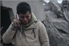  ??  ?? Boris Rodriguez, 24, who is searching for his wife, cries after seeing the condition of his neighborho­od, destroyed by the erupting Volcan de Fuego, or “Volcano of Fire,” in Escuintla, Guatemala on Monday. The volcano exploded Sunday, sending ash high...