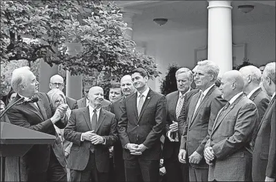  ?? [CHERISS MAY/SIPA USA] ?? During the victory party at the White House on Thursday, Health and Human Services Secretary Tom Price speaks with other members of the GOP. Although the House has passed a proposal to repeal or replace elements of the Affordable Care Act, the Senate...