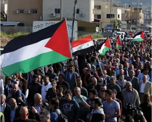  ??  ?? PEOPLE TAKE PART in a Land Day rally Friday in Arrabe, in northern Israel.