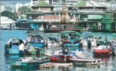  ??  ?? Fishing boats gather at Ap Lei Chau island.