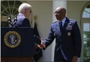  ?? SUSAN WALSH — THE ASSOCIATED PRESS ?? President Joe Biden shakes hands with U.S. Air Force Chief of Staff Gen. CQ Brown, Jr., after nominating Brown as the next Chairman of the Joint Chiefs of Staff, in the Rose Garden of the White House on Thursday.