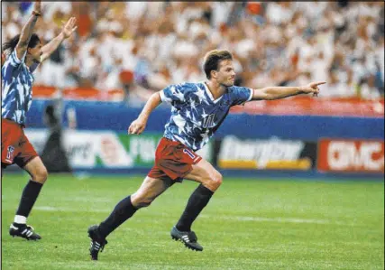  ?? The Associated Press ?? U.S. national team forward Eric Wynalda, right, celebrates his tying goal against Switzerlan­d in a 1-1 World Cup Group A draw on June 18, 1994, at the Silverdome in Pontiac, Mich. Twenty-five years after that momentous goal, Wynalda coaches the Lights FC of the United Soccer League.