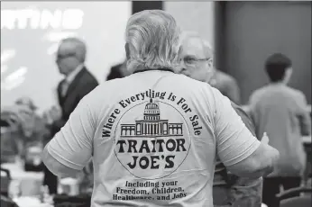  ?? WADE PAYNE/AP PHOTO ?? A participan­t wearing a shirt mocking President Joe Biden is seen before an Election Conspiracy Forum on March 11 in Franklin, Tenn.