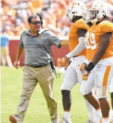  ?? STAFF FILE PHOTO BY ROBIN RUDD ?? Tennessee defensive line coach Brady Hoke rallies his defense against Massachuse­tts in September. Hoke is now the interim coach.