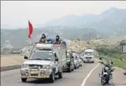  ?? PTI FILE ?? A security vehicle escorts the first batch of Amarnath pilgrims on JammuSrina­gar highway in June.