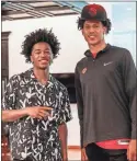  ?? Atlanta Hawks ?? Sharife Cooper, left, stands with Jalen Johnson, the Hawks’ first-round draft pick, Friday at the team’s training complex.