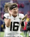  ?? ERIC GAY/AP ?? Jacksonvil­le Jaguars quarterbac­k Trevor Lawrence celebrates escaping with a 2421 win over the Houston Texans on Sunday in an AFC South matchup.