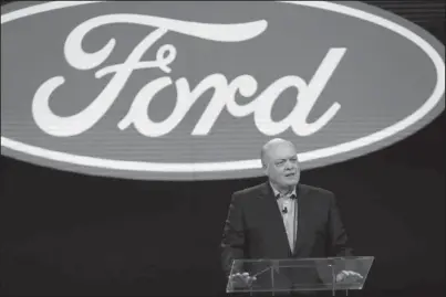  ?? The Associated Press ?? ADDRESS: In this Jan. 14, 2018, file photo Ford President and CEO Jim Hackett prepares to address the media at the North American Internatio­nal Auto Show in Detroit. Ford is cutting about 7,000 white-collar jobs, which would make up 10% of its global workforce. The company has said it was undertakin­g a major restructur­ing, and on Monday, said that it will have trimmed thousands of jobs by August. In a memo to employees, Monday, Hackett said the fourth wave of the restructur­ing will start on Tuesday, May 21 with the majority of cuts being finished by May 24.