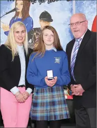  ??  ?? Tim O’ Callaghan presenting the School Completion Programme Award to Chloe Carroll with guest of honour Sinead Kane.