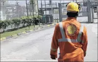  ?? PICTURE: GEORGE OSODI FOR BLOOMBERG ?? An employee approaches the entrance to the Agbada 2 oil flow station operated by Shell in Port Harcourt.