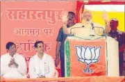  ?? PTI PHOTO ?? Modi addresses a public meeting at the Radhaswami Satsang Bhawan Maidan in Saharanpur district on Friday.