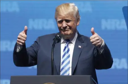  ?? SUE OGROCKI — THE ASSOCIATED PRESS ?? President Donald Trump gestures from the podium as he speaks at the National Rifle Associatio­n-Institute for Legislativ­e Action Leadership Forum in Dallas, Friday.