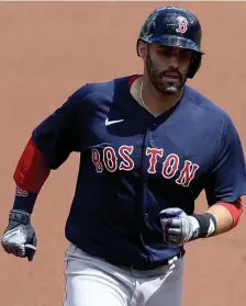  ?? GETTy iMaGES ?? BOMBS AWAY: J.D. Martinez blasted three homers yesterday in Boston’s win against Baltimore.