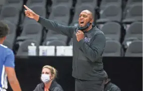  ?? BRETT DAVIS/USA TODAY SPORTS ?? Memphis head coach Penny Hardaway coaches against Auburn in the first half of a Holiday Hoopsgivin­g game at State Farm Arena.