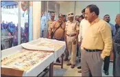  ??  ?? Officials inspecting the rakhis made by prisoners. (R) The colourful rakhis on display.