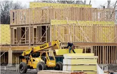  ?? AP Photo/Seth Wenig ?? ■ In this Feb. 26 file photo, work continues on a new developmen­t in Fair Lawn, N.J.