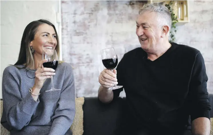  ?? PHOTOS: WONG MAYE-E/AP ?? Gypsy Diamond, 36, and Peter Peacock, 68, share a laugh over a glass of Shiraz, their favourite wine, in Melbourne. Peacock, who donated sperm anonymousl­y around 1980, was recently contacted by Diamond, his biological daughter, after a new law in Australia retroactiv­ely removed the anonymity granted to sperm donors decades ago.