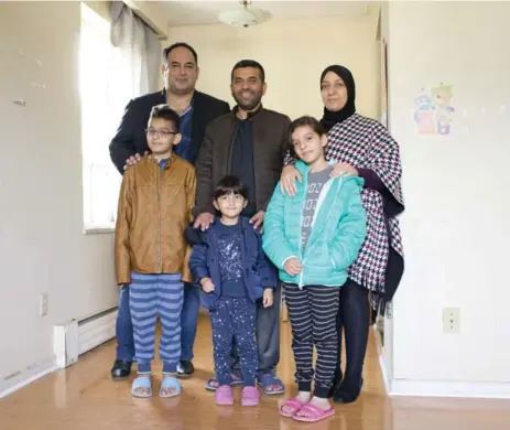  ?? LUCAS OLENIUK PHOTOS/TORONTO STAR ?? Alex Haditaghi, back left, and the Alawad family decided on a two-bedroom, second-floor unit with a balcony in a North York building.