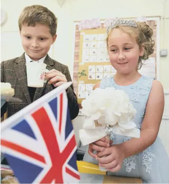  ?? ?? Pupils ready for the special afternoon tea on their Royal Day of Celebratio­n. Photos: Richard Ponter.