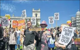  ?? AFP ?? People protest against the Conservati­ve Party and the Democratic Unionist Party in front of the Houses of Parliament in London on Saturday.