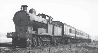  ?? H C Casserley R S Carpenter Photos/Brightman Series ?? When Stanier moved to the LMS in 1932 he decided to scrap the ex-L&NWR passenger classes as they became due for heavy repairs and replace them with his ‘Jubilee’ and ‘Black Five’ 4-6-0s, a process already begun with Fowler and his ‘Royal Scot’ and ‘Patriot’ 4-6-0s. As a result, those ex-L&NWR passenger locomotive­s that remained in traffic were cascaded down to local workings, primarily in the London, Birmingham and Chester areas. On an unrecorded date in 1936 we find
Bowen Cooke ‘Prince of Wales’ class 4-6-0 No 25706 Canning (L&NWR No 504 of March 1919) in charge of a five-coach Euston to Watford semi-fast duty. Still capable of speeds in the 70mph range, No 25706 would be withdrawn in December 1936 after a working life of just 17 years.
On the evening of Thursday, 12 September 1946 a very tired looking Bletchley-allocated ex-L&NWR ‘Prince of Wales’ class 4-6-0, No 25752
(L&NWR No 1557 of November 1919), has called at Watford Junction with an outer suburban service to Bletchley. Renumbered as LMS No 5752 in May 1927 and to No 25752 in June 1936, this 4-6-0 would not be taken out of service until May 1949, when on the books of Stafford shed. These trains were well patronised in the immediate post-war years and here we see over two dozen passengers waiting to join this working to Bletchley, while a number of railwaymen can also be made out on the platform.