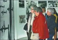  ?? LONG JIANWU / CHINA NEWS AGENCY ?? Visitors tour an exhibition about the Nanjing Massacre, in which 300,000 died in 1937, at the Memorial de Caen museum in France.