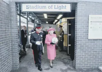  ??  ?? Her Majesty The Queen in Sunderland with the posy given to her by Lois Chapman.