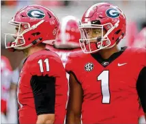  ?? CURTIS COMPTON / CCOMPTON@AJC.COM ?? After Georgia’s loss last week to LSU, some wonder whether Bulldogs quarterbac­k Jake Fromm (left) will start ceding snaps to dual-threat freshman Justin Fields.