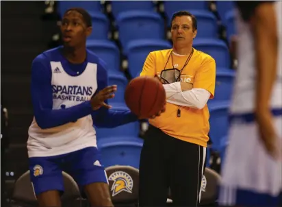  ?? NHAT V. MEYER — BAY AREA NEWS GROUP ?? San Jose State University head basketball coach Tim Miles coaches his team, including Omari Moore (10) during practice at the Event Center at SJSU in San Jose on Jan. 5, 2022.