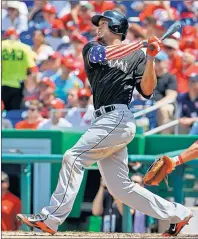  ?? THE ASSOCIATED PRESS ?? Miami Marlins baseball star Giancarlo Stanton, shown hitting a two-run homer this spring, recently signed a $325 million, 13-year contract.