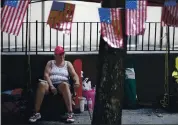  ?? MIKE SIMONS — TULSA WORLD VIA AP ?? Rose Brown and other Trump supporters line up and camp on Fourth Street in downtown Tulsa, Okla., on Friday, ahead of President Donald Trump’s campaign rally today.