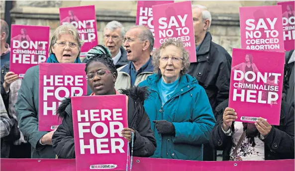  ??  ?? Pro-life campaigner­s demonstrat­e outside Ealing Broadway Town Hall before the abortion buffer zone vote this week