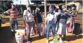  ??  ?? Food parcels handed out at the Magalela informal settlement near Hazyview.