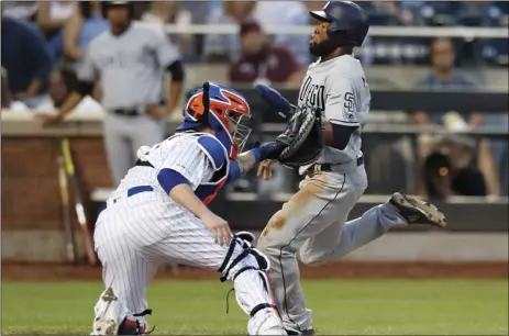  ?? PHOTO/KATHY WILLENS ?? New York Mets catcher Tomas Nido (3) reaches out trying to tag San Diego Padres’ Manuel Margot scores on Eric Hosmer’s third inning sacrifice fly in a baseball game, on Wednesday, in New York. AP