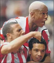  ??  ?? JOY: Anton Ferdinand and El- Hadji Diouf help Kieran Richardson celebrate his 2008 derby winner against Newcastle, one of the high points of Keane’s reign.