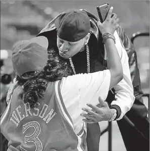  ?? MATT ROURKE / ASSOCIATED PRESS ?? Allen Iverson greets his mother, Ann Iverson, as he arrives for Wednesday’s media conference in Philadelph­ia where he officially announced his retirement from the NBA. Iverson won the 2001 MVP award and four scoring titles during his 15-year career.