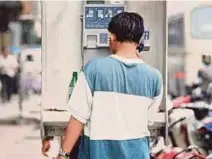  ?? FILE PIC ?? Not so long ago, people used public pay phones to get in touch with someone.