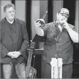  ?? AL WAGNER/INVISION ?? Country music star Luke Combs, right, speaks after his Grand Ole Opry induction as Vince Gill looks on.