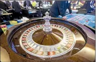  ?? NWA Democrat-Gazette/BEN GOFF ?? A roulette wheel spins at Cherokee Casino &amp; Hotel in West Siloam Springs, Okla., on August 23. Some Oklahoma casinos have been granted permission to install “ball and dice” games including roulette and craps.