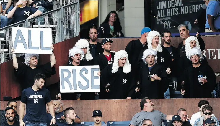  ?? ELSA / GETTY IMAGES ?? Fans of New York Yankee Aaron Judge cheer him on in the The Judge’s Chambers at Yankee Stadium. Judge has been launching some tape-measure homers for the Yankees but selling more tickets and suites and pulling in greater attendance will take more than any one player’s star power.