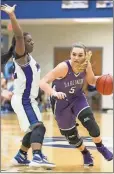  ?? Photo by Steven Eckhoff ?? Darlington’s Anna Claire Atha tries to get around Model’s Moe Welch during Friday’s game in the Region 7-AA tournament semifinals. The Lady Blue Devils came away with a 65-49 win against the Lady Tigers.