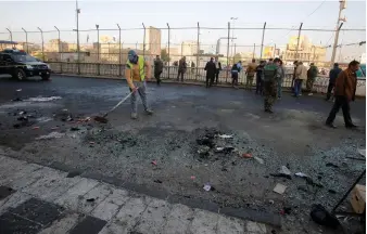  ?? Reuters ?? Iraqi security forces at the site of a double bomb attack in central Baghdad yesterday