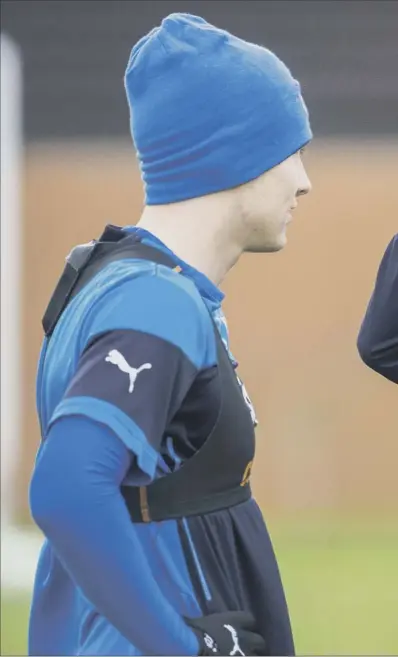  ??  ?? Rangers manager Ally McCoist, speaking here with midfielder Lewis MacLeod at training, was in mischievou­s