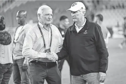  ?? ADAM CAIRNS/THE COLUMBUS DISPATCH ?? Columbus Crew owners Jimmy Haslam, left, and Pete Edwards shake hands following the MLS match against CF Montreal at Lower.com Field. The teams played to a 0-0 draw.