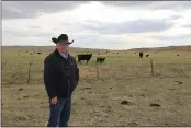  ?? TODD VON KAMPEN — THE TELEGRAPH ?? Rancher Rusty Kemp near grazing cattle on his Pioneer Ranch northwest of Tryon, Neb.