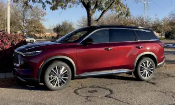  ?? ?? A bright bordeaux with black roof for the 2024 Infiniti QX60. (Bud Wells photos)