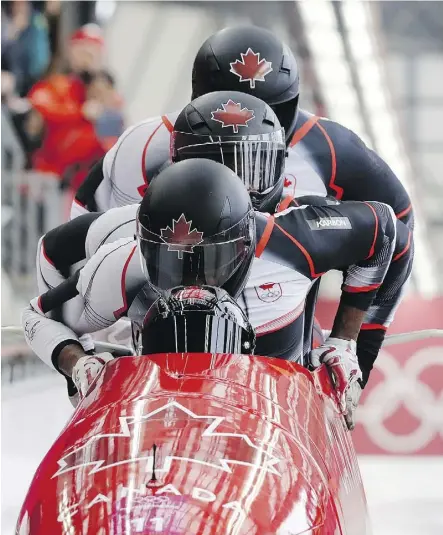  ?? WONG MAYE-E/THE ASSOCIATED PRESS ?? Christophe­r Spring, Lascelles Brown, Bryan Barnett and Neville Wright of Canada’s four-man bobsled crew in Pyeongchan­g. Canada’s bobsledder­s had won two medals as of Friday.