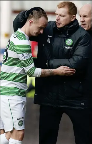  ??  ?? Now HIbernian gaffer Neil Lennon embraces Leigh Griffiths during his time as Celtic manager